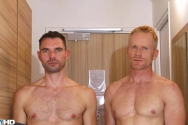 Handsome blonde fitness trainer serviced by a huge dick guy.